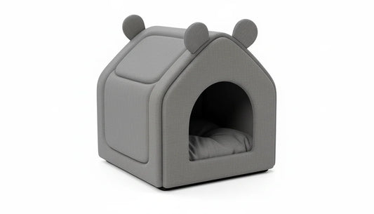 A gray, plush pet bed with a house-like design and rounded ears on top