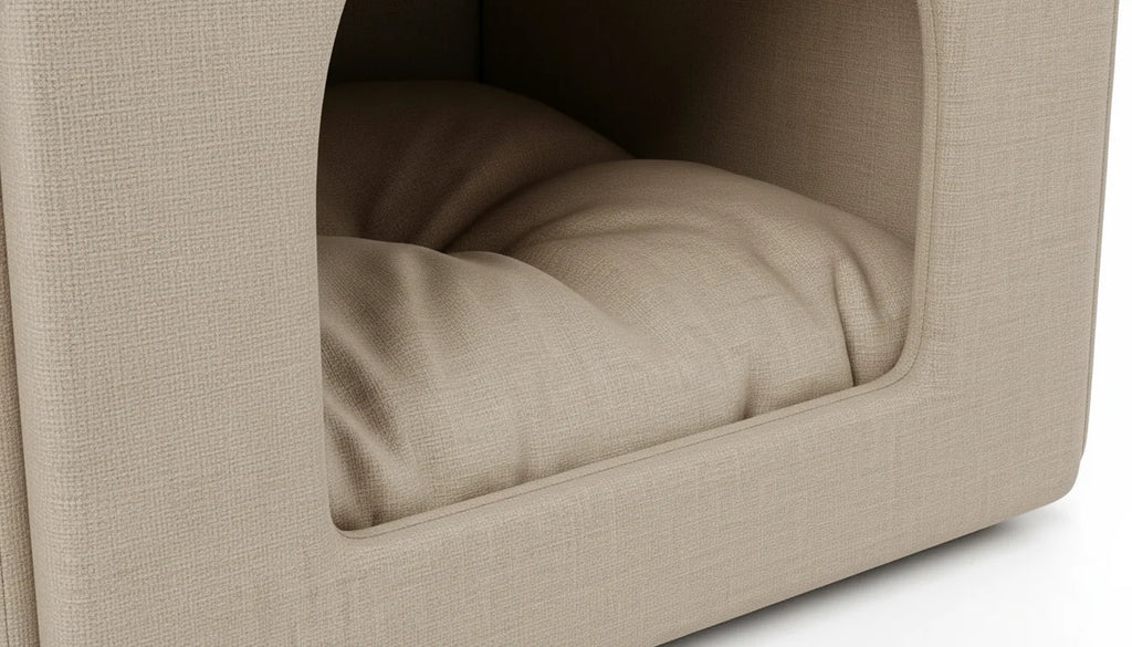 Close-up of a beige fabric dog bed with a plush cushion inside a cozy nook