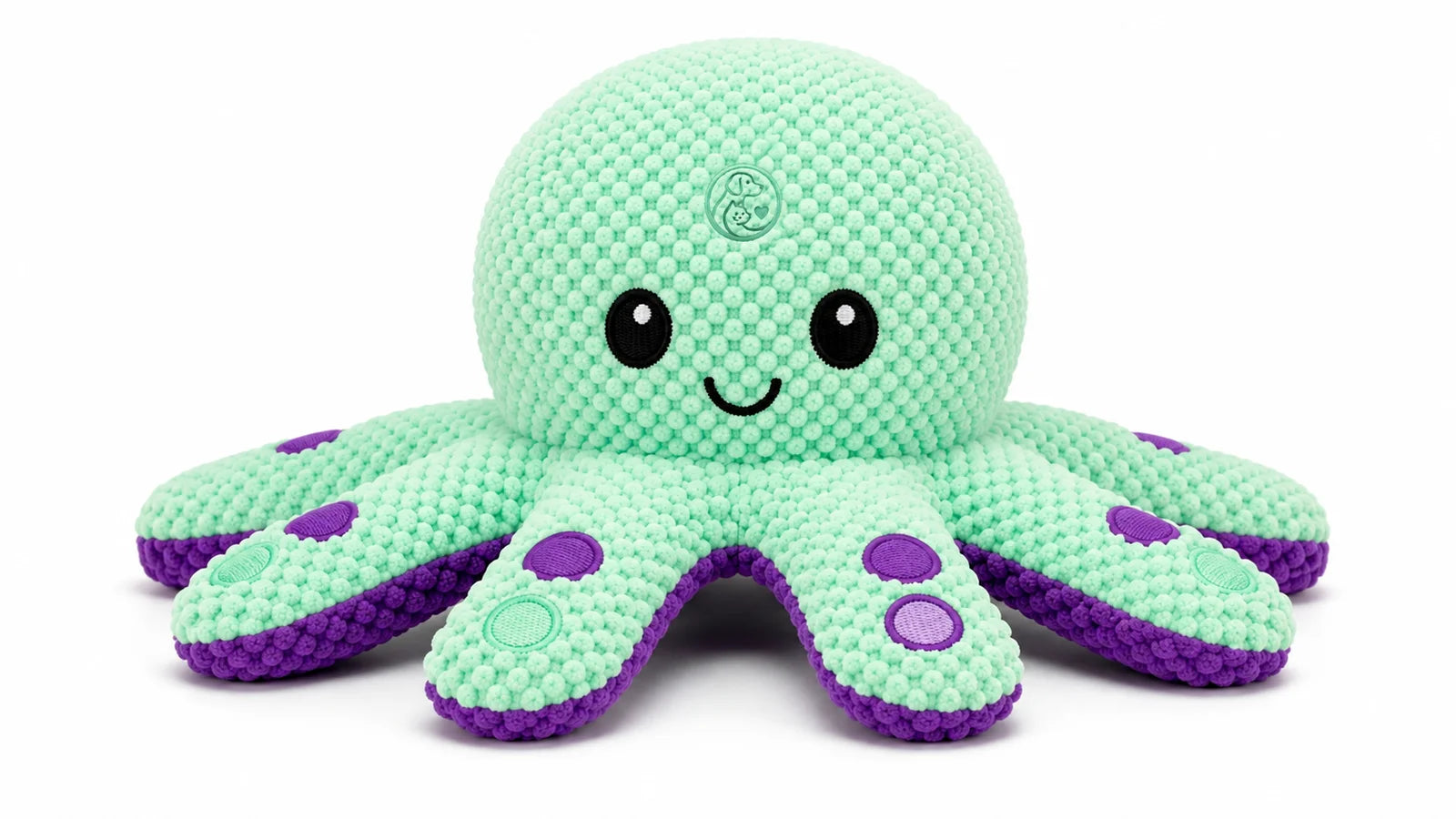 A mint green and purple crocheted octopus plush toy with a smiling face and eight tentacles