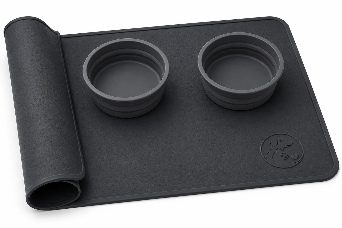 Black silicone mat with two bowls and rolled edge on white background