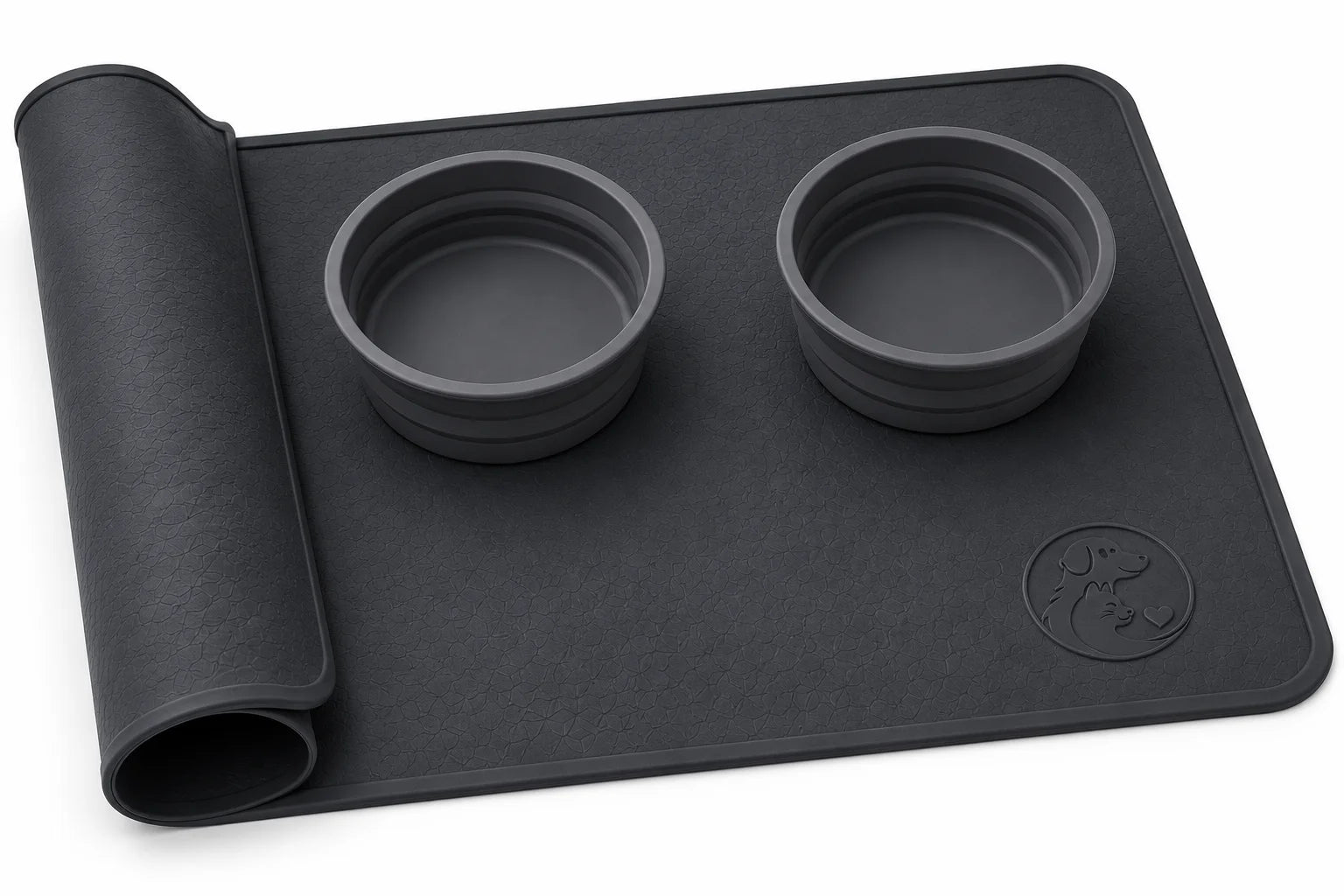 Black silicone mat with two bowls and rolled edge on white background