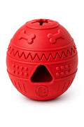 A red rubber dog toy with bone and triangle shaped holes for treat dispensing